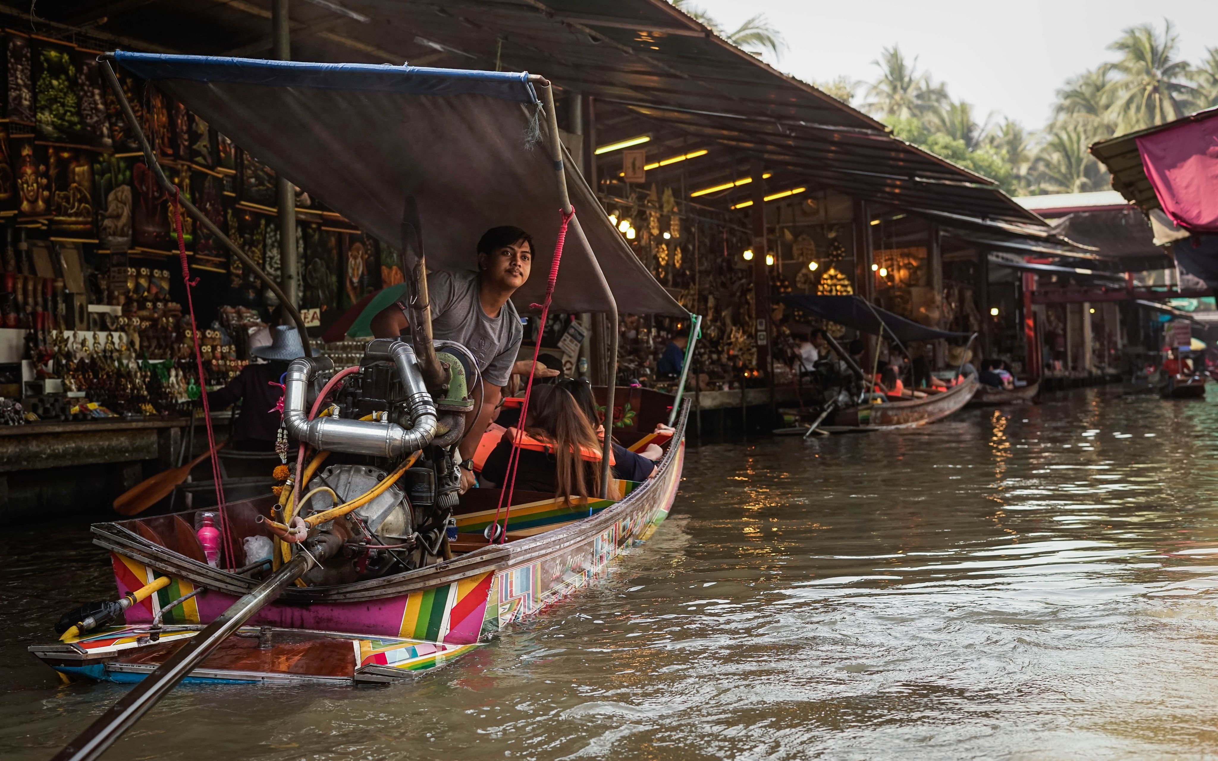 a person on a boat in a flooded area