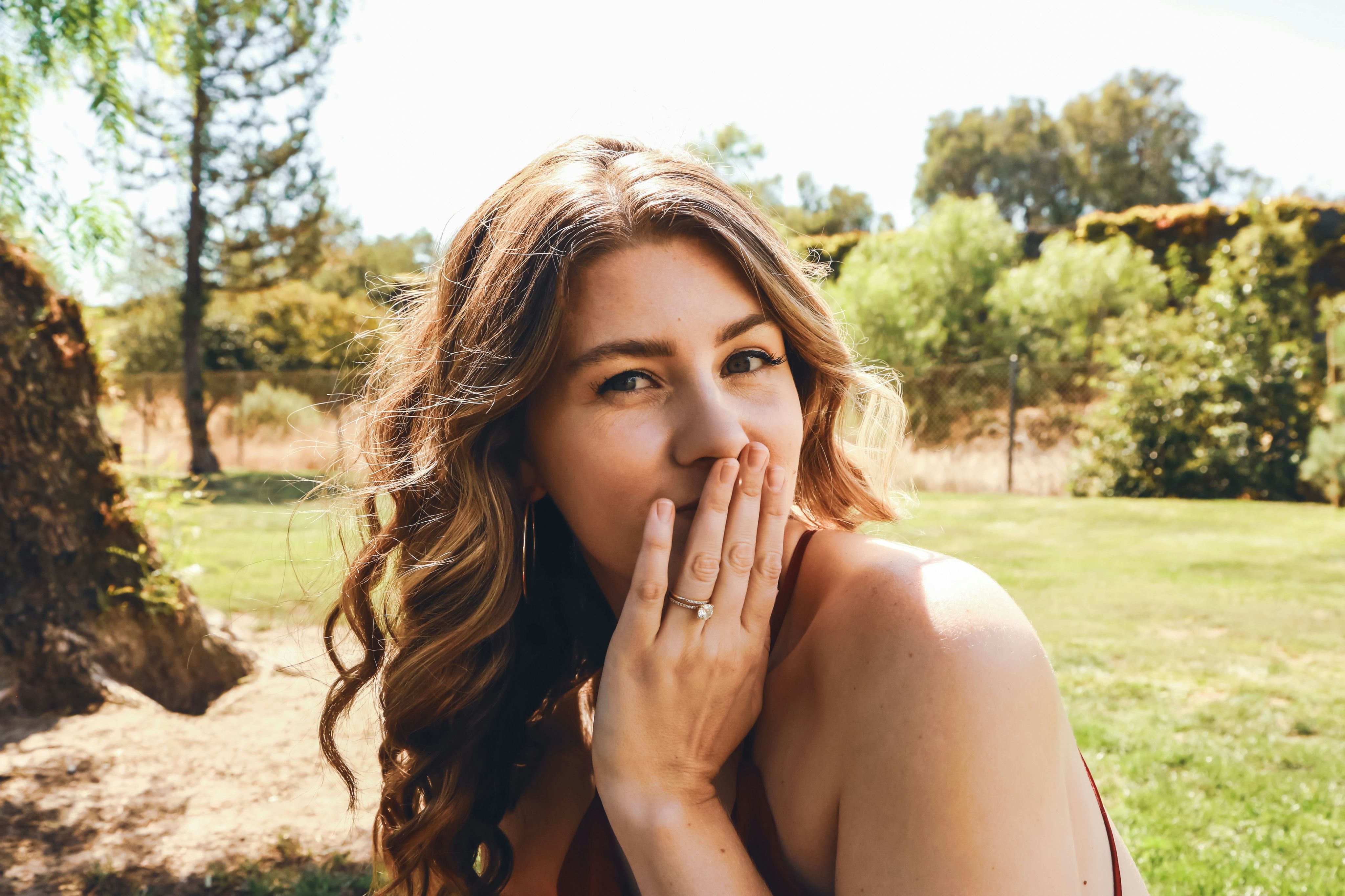 a woman with her hand on her face